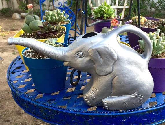 silver elephant watering can