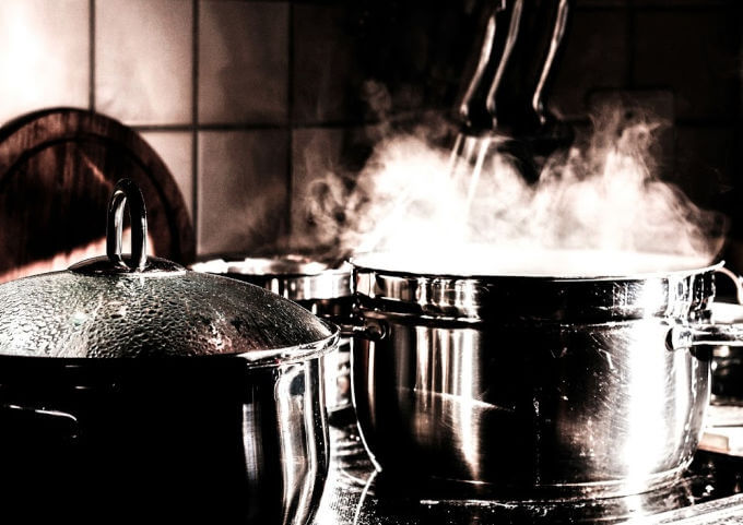 photo of steaming pots on the stove