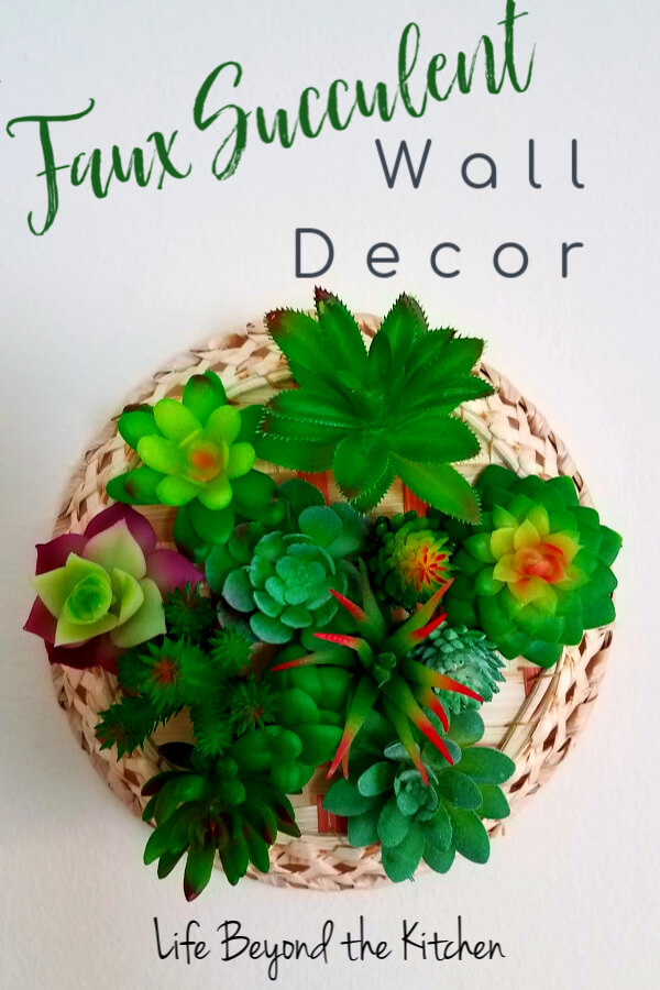 large photo of a wall decor made from faux succulents