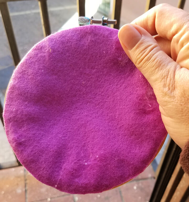 image of the back of an embroidery hoop covered with felt
