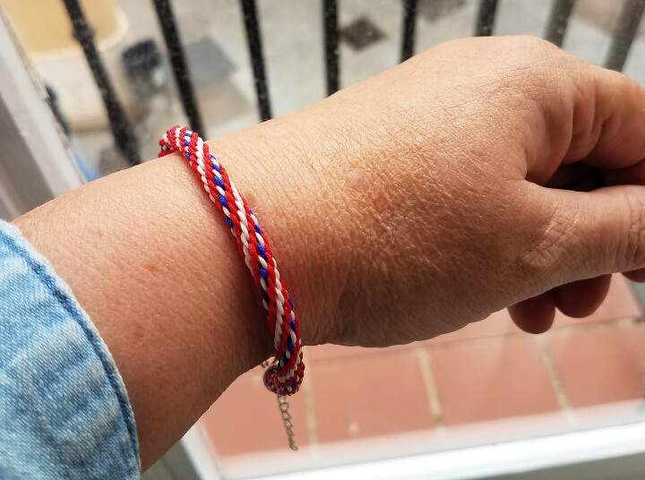 photo of an American flag kumihimo bracelet attached to a women's wrist