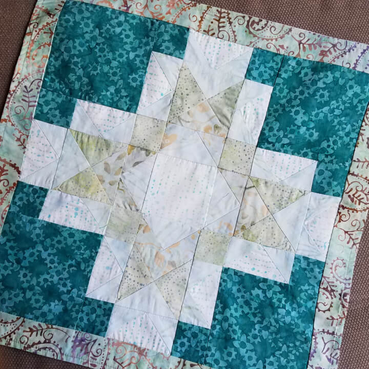 quilted square made from an adult craft kit that will be used as a dresser top