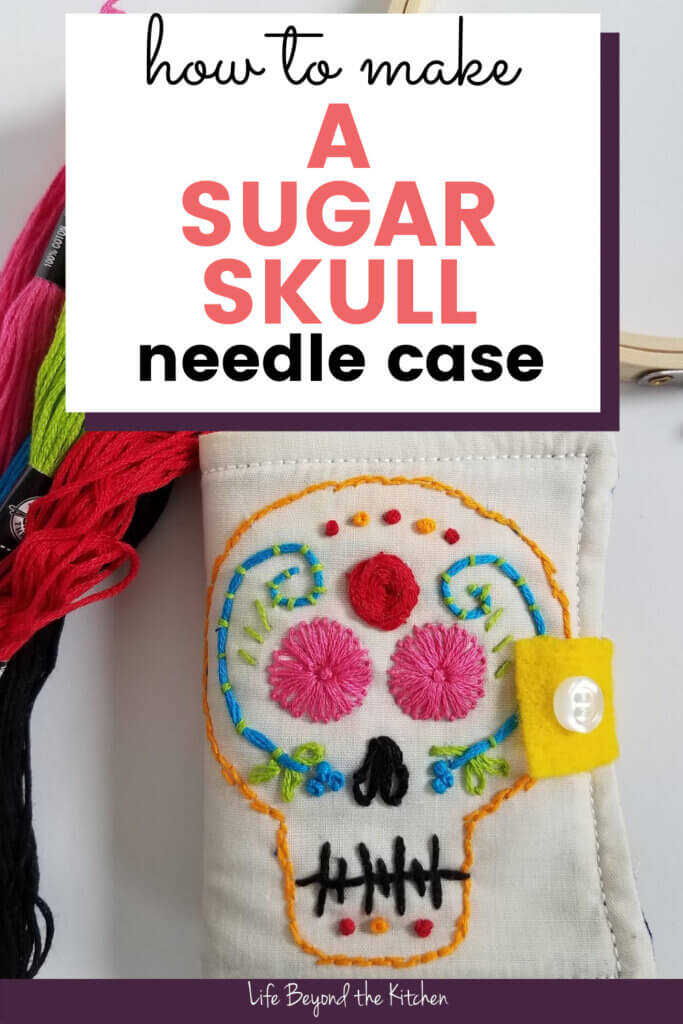 large photo with text of a needle case with an embroidered sugar skull on the front