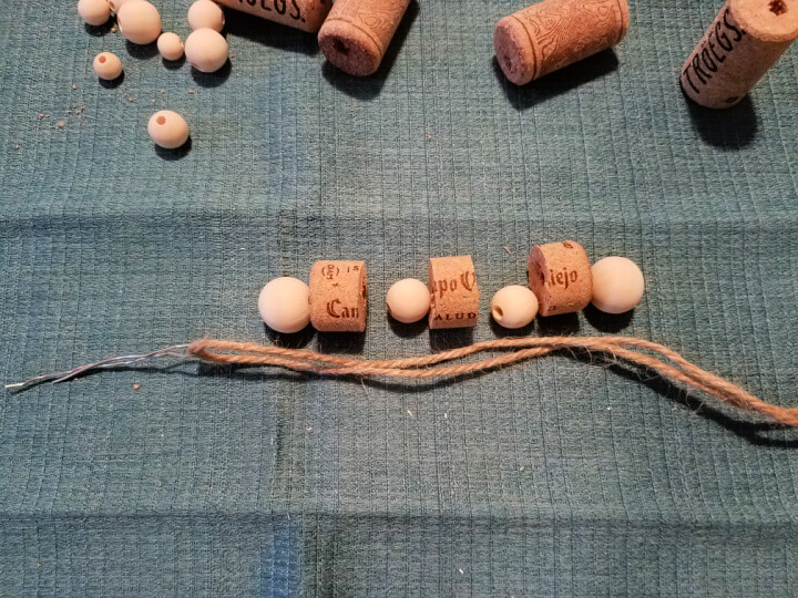 laying out the components to make a cork and bead toy