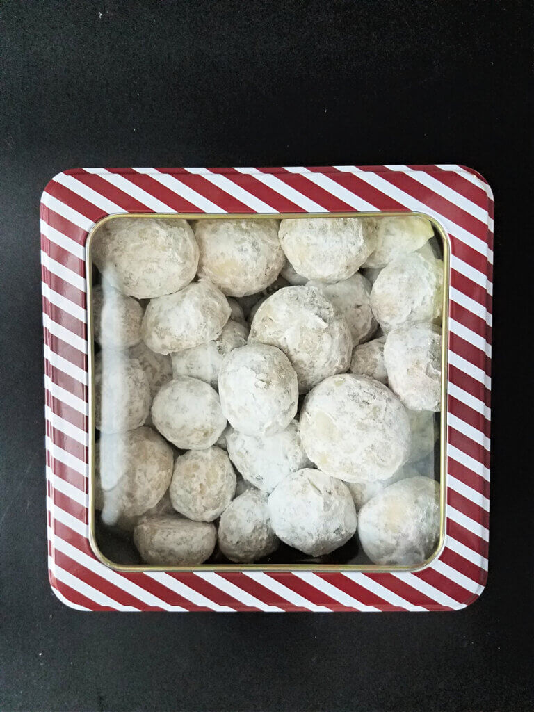 nut snowballs in a decorative tin