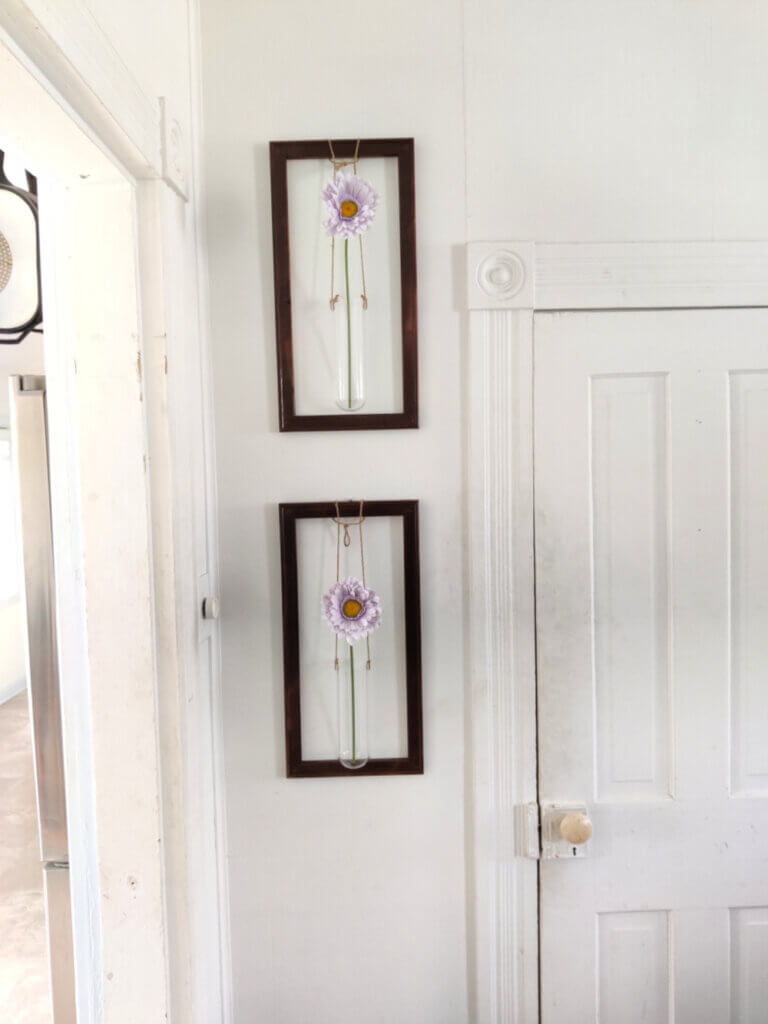 framed vases hanging vertically
